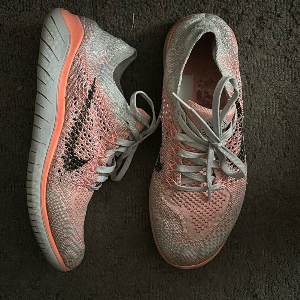 Women’s Nike Free RN Flyknit running shoes grey and orange